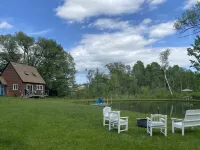 Home with a spring-fed pond and mountain view.