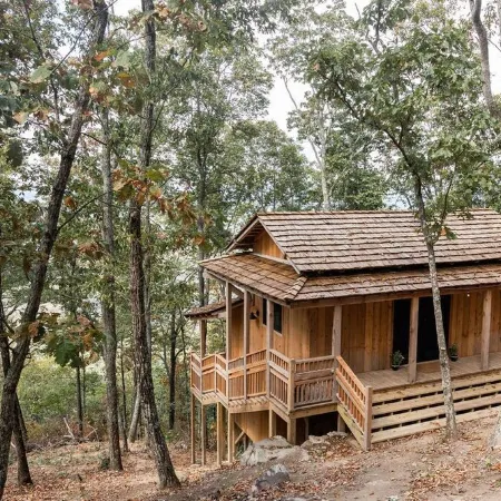 Japanese timberframe tiny house perched on side of Lookout Mountain