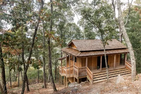 Japanese timberframe tiny house perched on side of Lookout Mountain