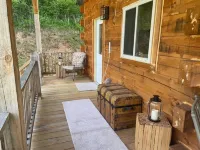 Cozy hillside retreat near trout stream, public forest and UTV trails.