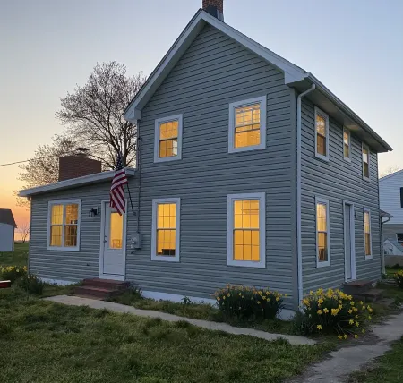 Single family home with screened porch.