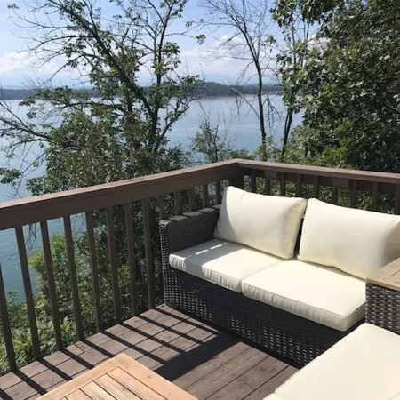 Amazing Lake and Smoky Mountain Views from this Charming Lake House.