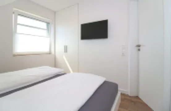 Comfortable apartment on the upper floor for 4 people with balcony, garden & terrace.