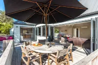 All day sun house with metres away from the golden sands of Onetangi Beach.