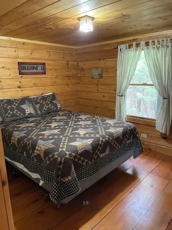 Rustic log cabin on beautiful Maidstone Lake