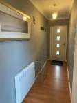 Spacious & homely ground floor apartment in central village location near beach