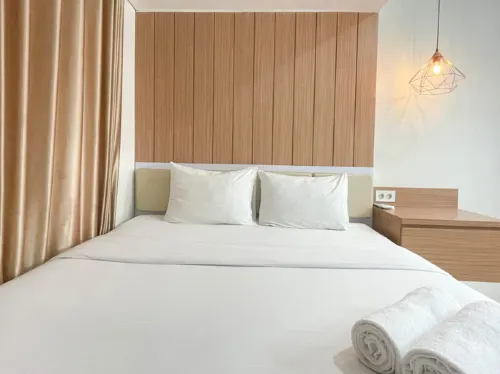 Wooden Accents 1BR at Podomoro City Deli Medan Apartment By Travelio