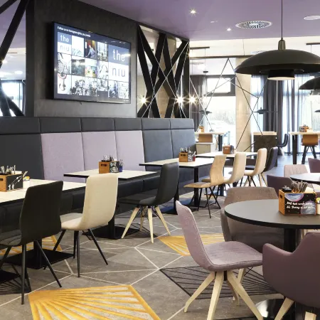 Holiday Inn - the niu, AIR FRANKFURT MESSE by IHG Отели рядом с достопримечательностью «Нидеррад»