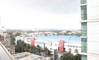 Prime and Comfy Studio at Tamansari la Grande Apartment by Travelio