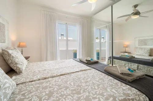 B1, in a small complex with communal heated pool 100m from the sea