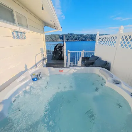 Waterfront Villa with Private Beach, Hot tub, EV & WFH