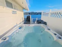 Waterfront Villa with Private Beach, Hot tub, EV & WFH