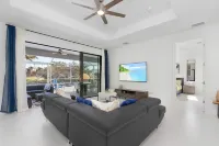 Deluxe 4BD/3BH Waterfront Home with Heated Pool and Golf Access and EV Charger