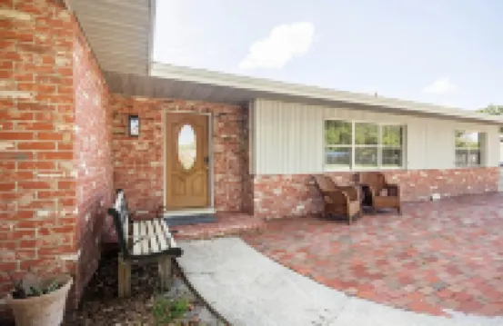 Home with play room, enclosed pool and hot tub. Only 10 minutes from the beach!