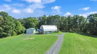 Private, modern home with river view, on 48 acres