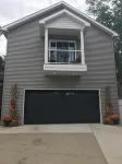 View of Lake Fenton with hot tub and fire place