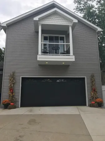 View of Lake Fenton with hot tub and fire place