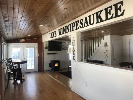 Winnipesaukee lakefront house includes slip, deck, hot tub & sleeps up to 11
