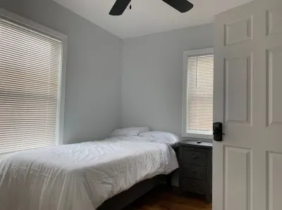 Open Kitchen with Quartz Countertops and Modern Appliances - Stylish Retreat Hotels near Stoneham Recreation Department
