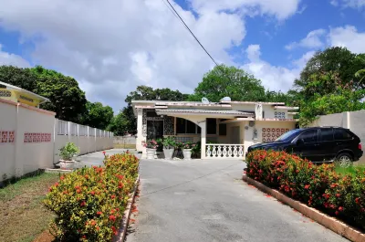 Welcome to the Unpretentious and Breezy Graceville, Steps Away from the Beach Hotels near Gibbs Bay