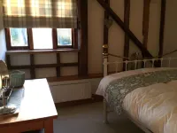 A peaceful ground floor apartment within our refurbished Sussex barn.