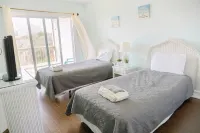 Beach House with a Pool, Gameroom and Steps from Ocean