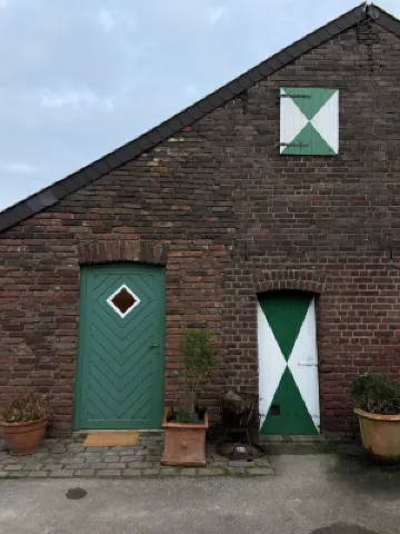 Comfortable living on a farm surrounded by greenery and art