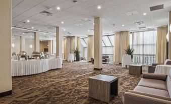 a large conference room with tables and chairs set up for a meeting or event at Best Western Plus Pontoon Beach