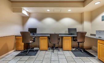 a conference room with three chairs arranged around a long table , and a television mounted on the wall at Hilton Vacation Club Lake Tahoe Resort South