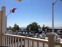 Right across from Beach and Grand Haven Pier!  Beautiful Lake and Sunset Views!