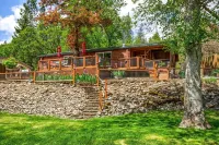 'RIVER HAVEN' is a serene riverside cabin on the Rogue River Hotels near Citadel Rd