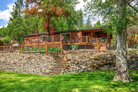 'RIVER HAVEN' is a serene riverside cabin on the Rogue River