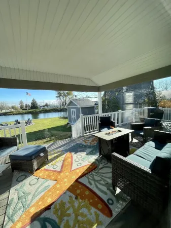 Cozy riverfront cottage with an easy beach-inspired coastal MI vibe!