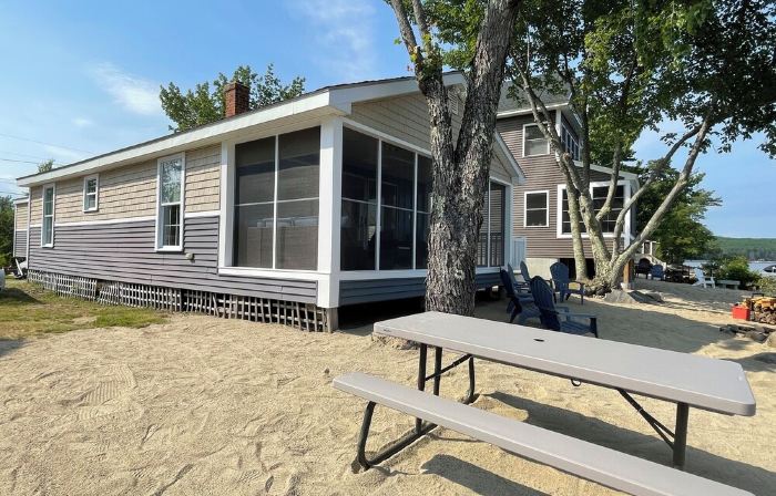 Cozy lakefront home on Ossipee Lake, w/beach, dock and amazing view.