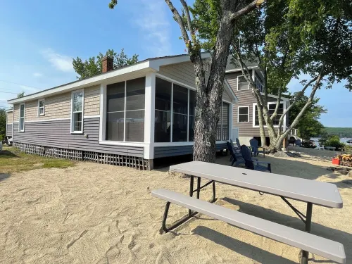 Cozy lakefront home on Ossipee Lake, w/beach, dock and amazing view.