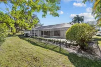 Riverside Retreat: 4BR/3BA with Private Dock and Boat Lift Hotels near Santa Lucia River Club