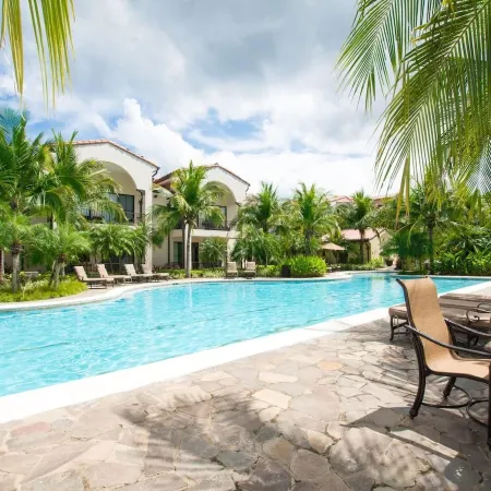 Colorful Poolside Condo w/ Garden-View Patio & Resort-Style Amenities