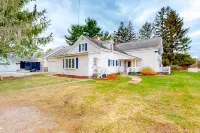 Warm & inviting retreat with a full kitchen, gas fireplace, & furnished patio