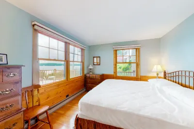Lakeside cottage with Lake Winnipesaukee views & private boat dock, dog-friendly