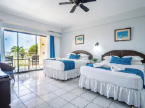 Tropikist Beach Hotel & Resort Hotels near A.N.R. Robinson International Airport