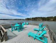 Spacious 7-bedroom, 5-bath home on 168' of a wide, deep-water cove.