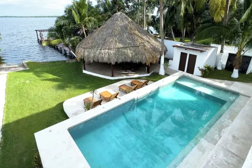 Casa Xchel in front of the bay, pool, jacuzzi and deck.