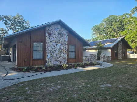 Charming private 4-bedroom estate on over 1 acre of land.