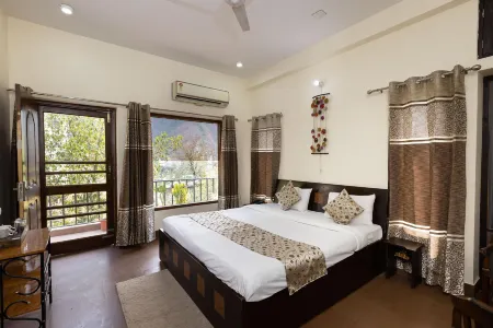 Yogved Hospitality & Resort Отели рядом с достопримечательностью «Laxman Jhula»