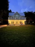 Charming historic Little Blue House with a water view.