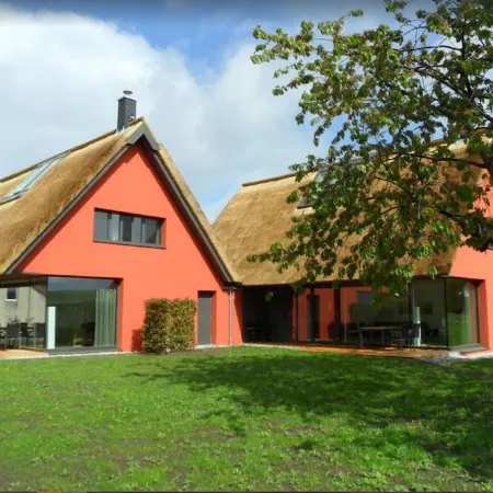Thatched roof meets modernity, lake view; sauna, garden and much more...