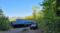 Cozy cool cabin in the mountains with a view Close to Downtown with a hot tub