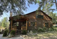 Lakefront luxury, Lake George log cabin home with your own private sandy beach