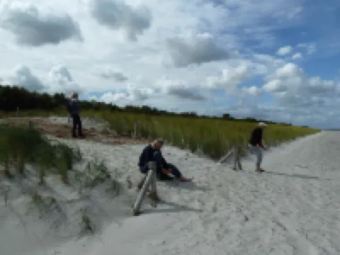 Holiday apartment on the beach in a traditional thatched-roofed house