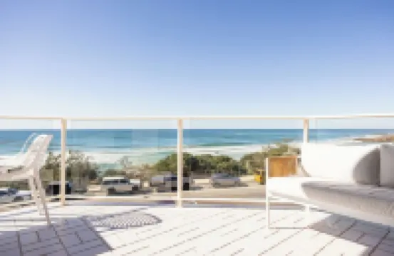 Contemporary beachfront apartment with breathtaking panoramic ocean views.